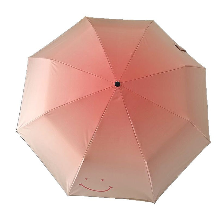 Women's foldable umbrella with playful design and handy wooden handle Bowlift