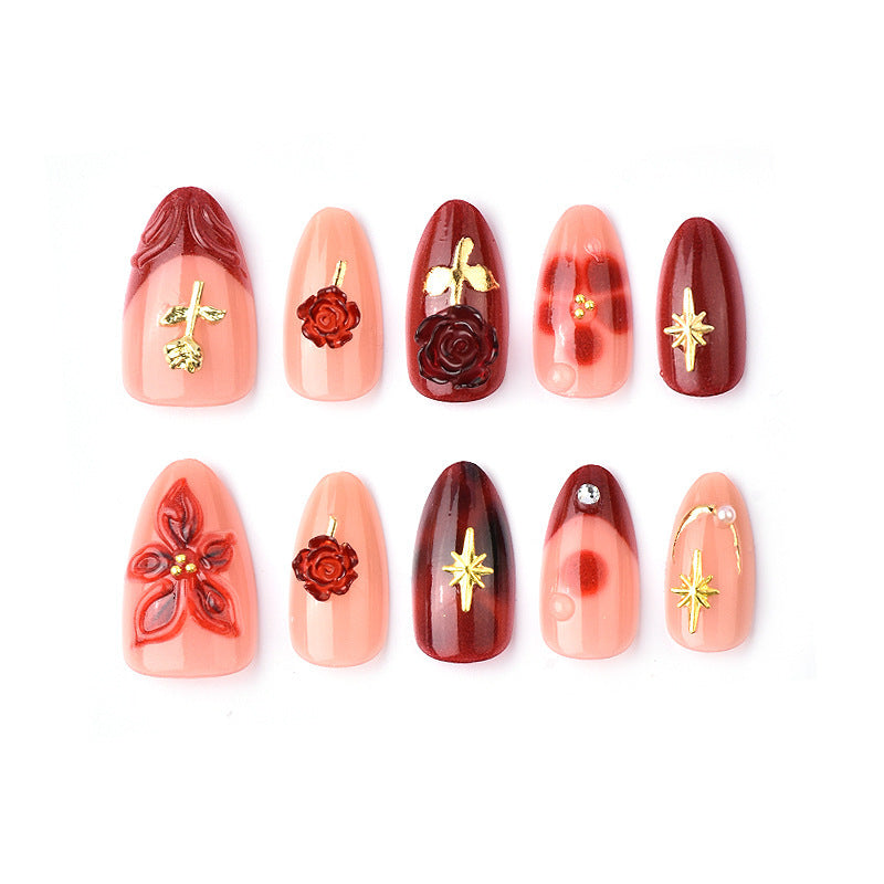Artificial nail set with elegant floral applications and glamorous accents Bowlift