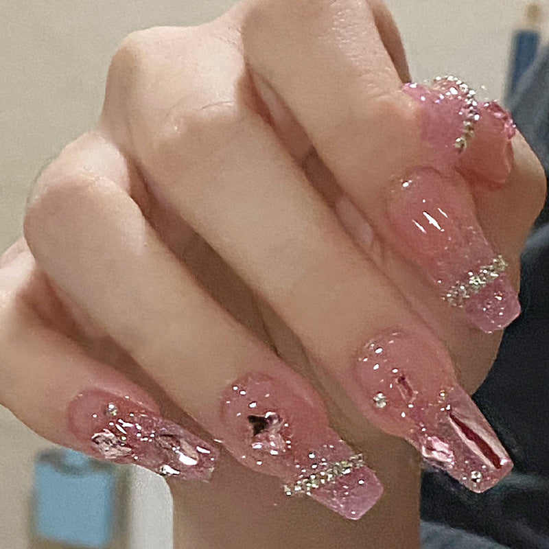 Artificial nails with heart design and glitter accents Bowlift