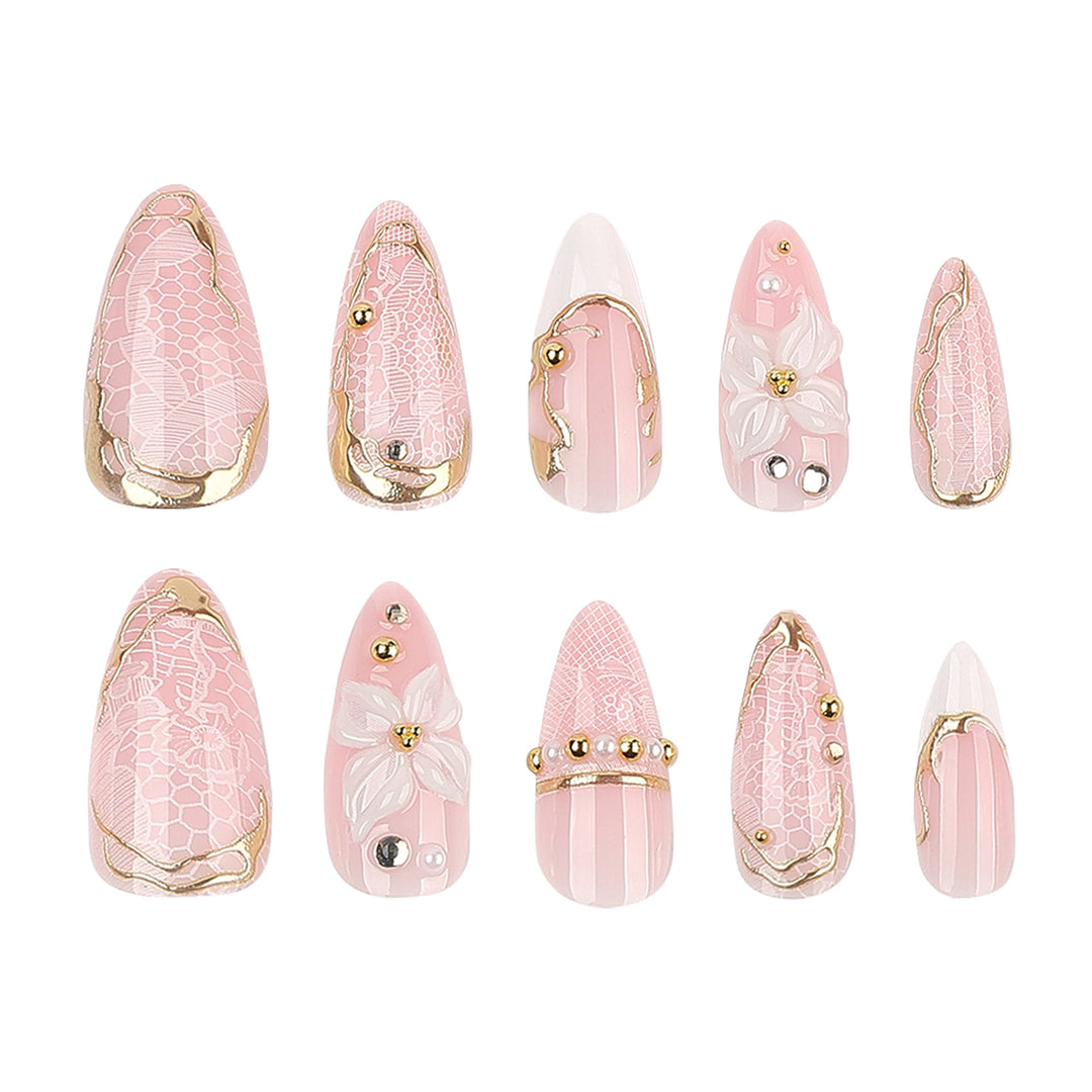 Artful nail extensions with delicate flower and gold embellishments Bowlift