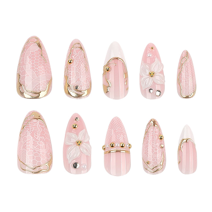 Artful nail extensions with delicate flower and gold embellishments Bowlift