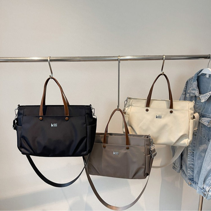 Shopping bag with comfortable carrying system and practical outer pockets Bowlift