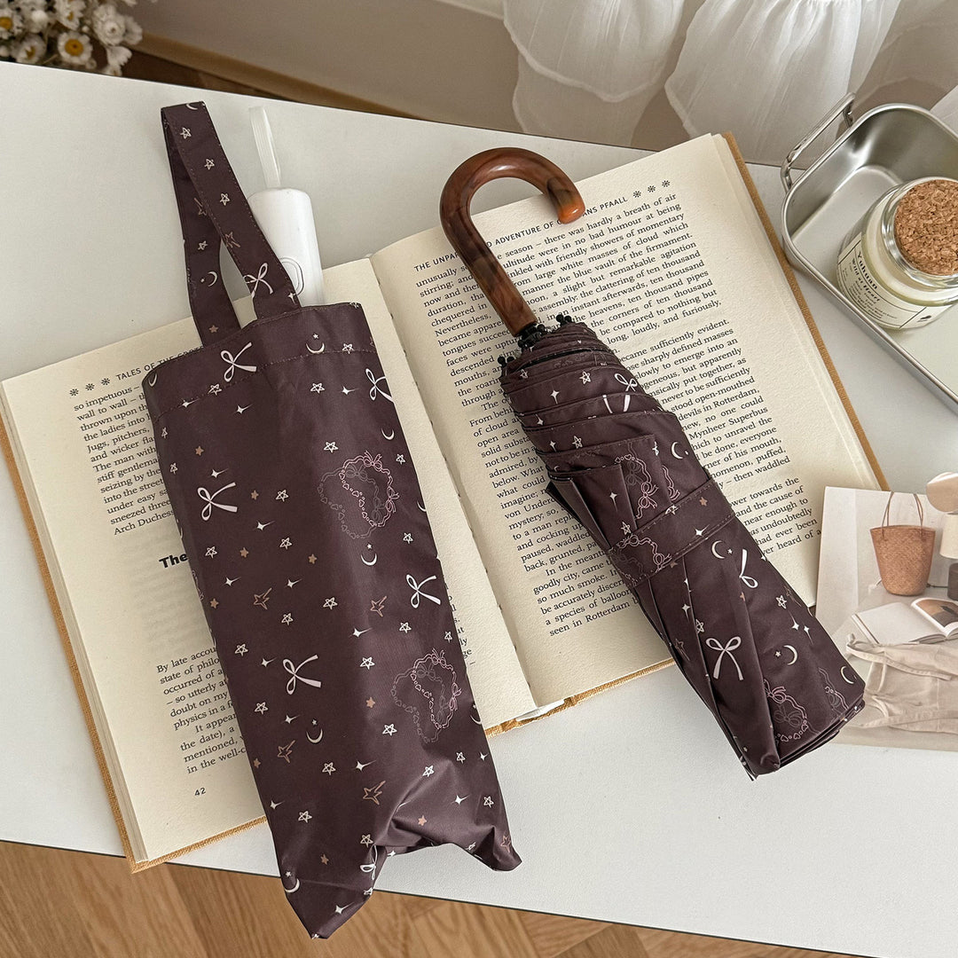 Women's folding umbrella with elegant pendant design Bowlift