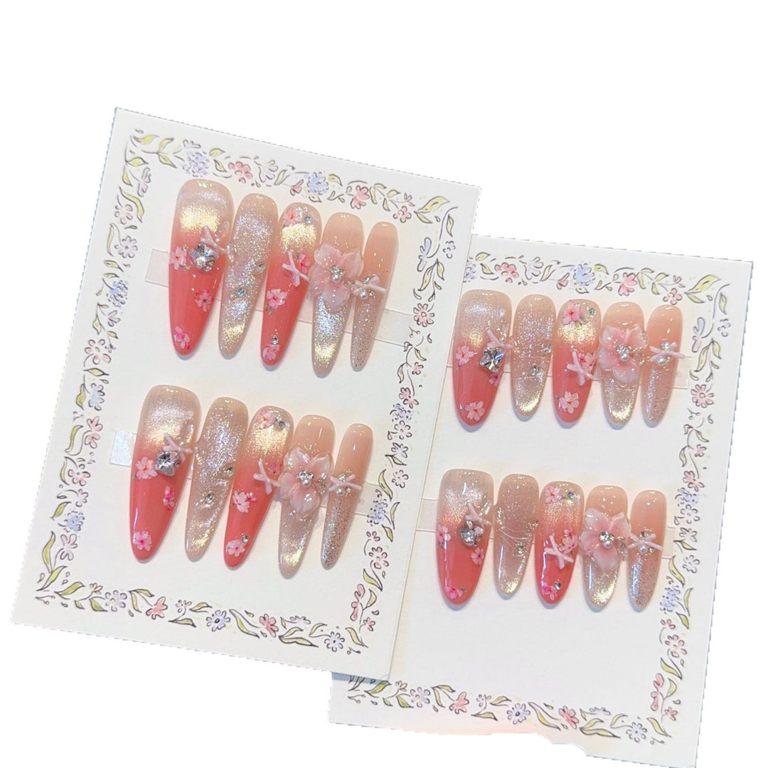 Artificial nails with floral embellishments and glitter effects Bowlift