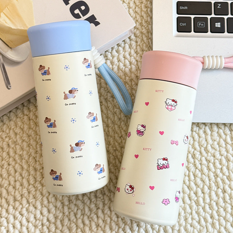 Women’s insulated drinking bottle with practical carrying strap and playful design Bowlift