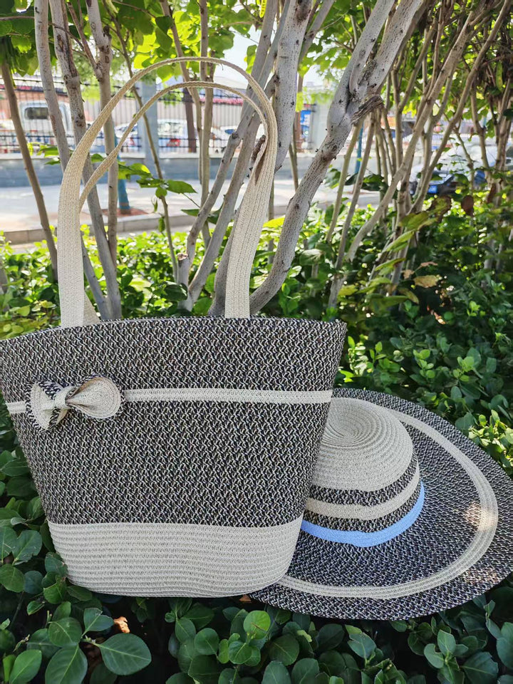 Elegant sun hat with wide brim and subtle stripe pattern Bowlift
