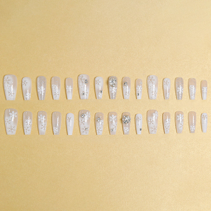 Artificial nail set with frosty snowflake design and sparkling 3D applications Bowlift