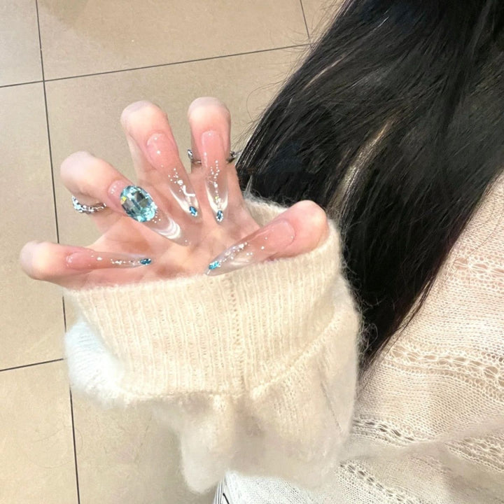 Artistic Stiletto Press-On Nail Art with Glimmering Accents Bowlift