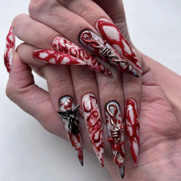 Creative Stiletto Nail Art with Blood Red Accents Bowlift