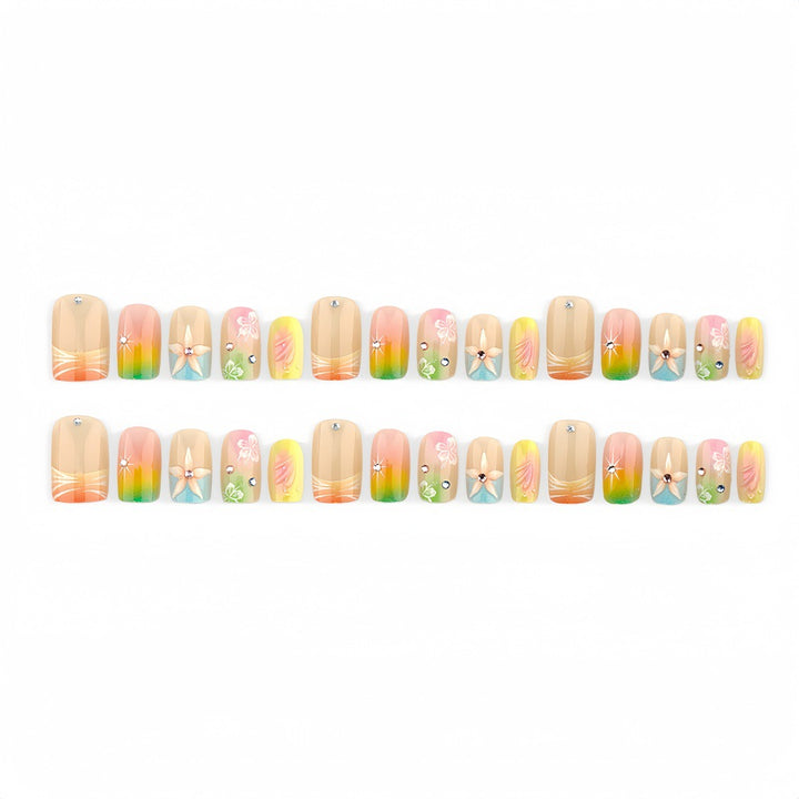 Acrylic nails with floral accents and gradient Bowlift