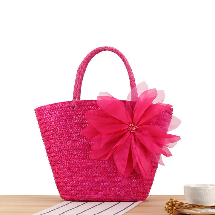 Elegant straw bag with floral accents Bowlift