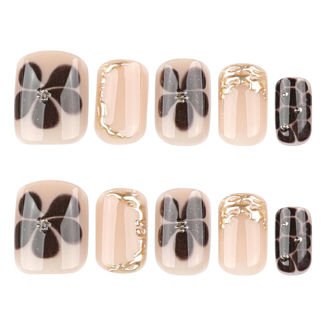 Artistic Nail Art with Elegant Golden Accents Bowlift