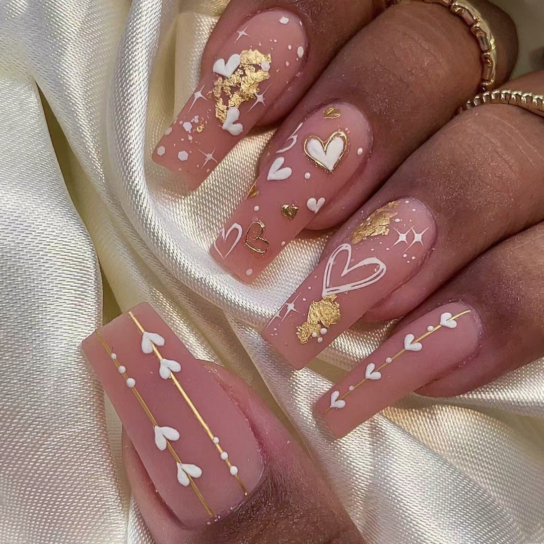 Artificial nail art with heart and glitter designs Bowlift
