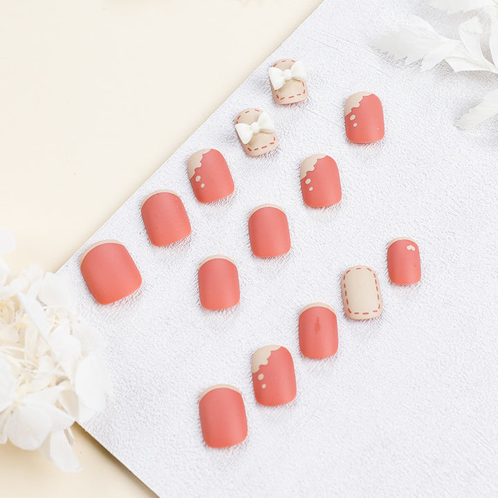 Artistic nail nails with decorative bow designs and French tips Bowlift