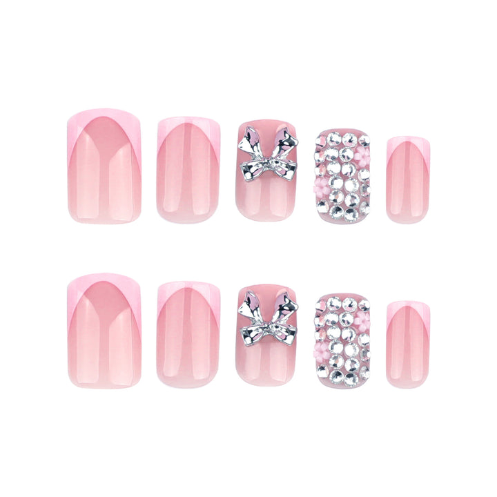 Artful nail art with glitter accents and bow decoration Bowlift
