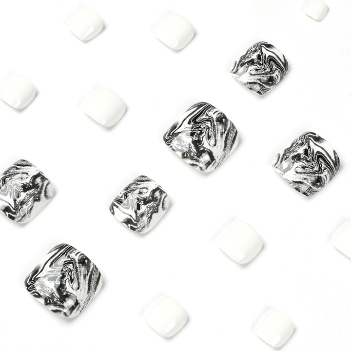 Artful toenail art in elegant marble design Bowlift