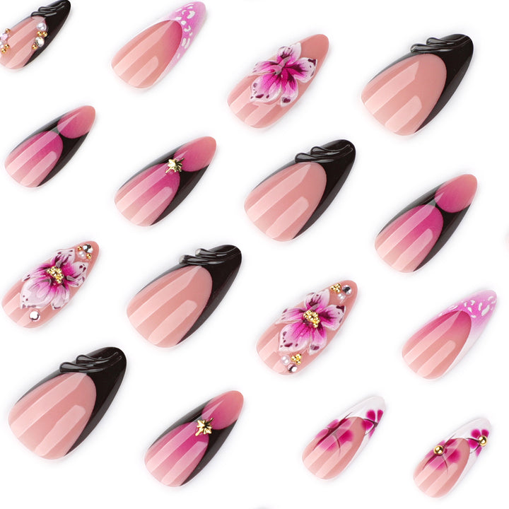 Artful stiletto nails with blooming design and glitter accents Bowlift