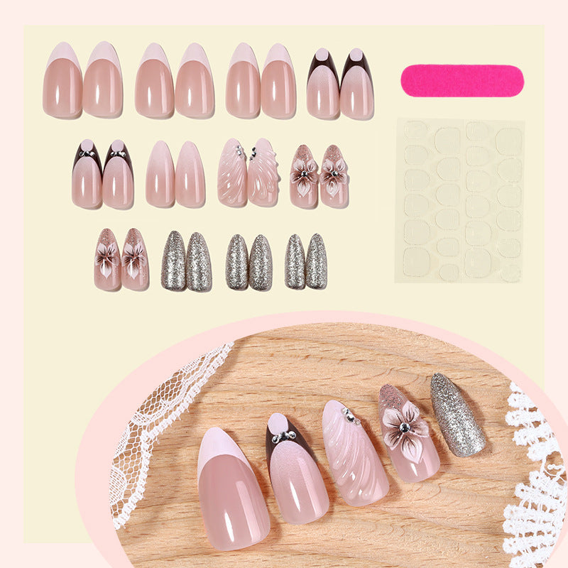 Artificial nail set with elegant flower and glitter accents Bowlift