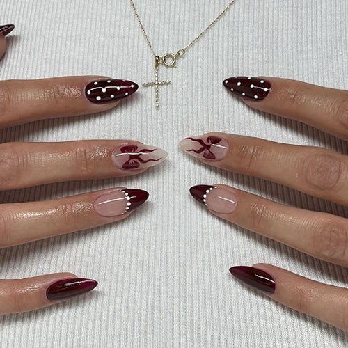 Elegantly designed stiletto nails with artistic accents Bowlift