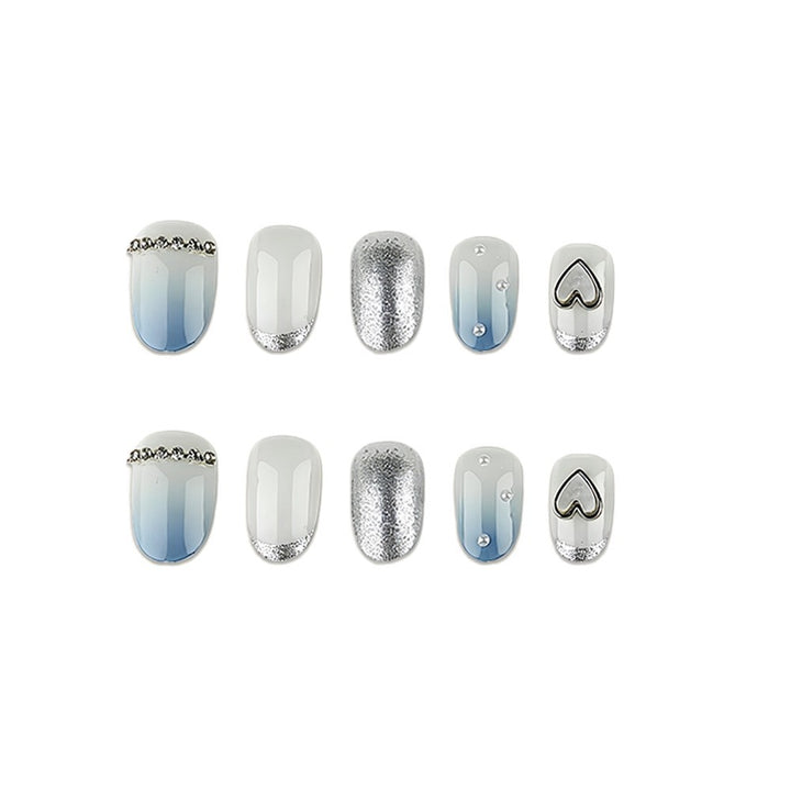 Glamorous artificial nails with heart design and pearl details Bowlift