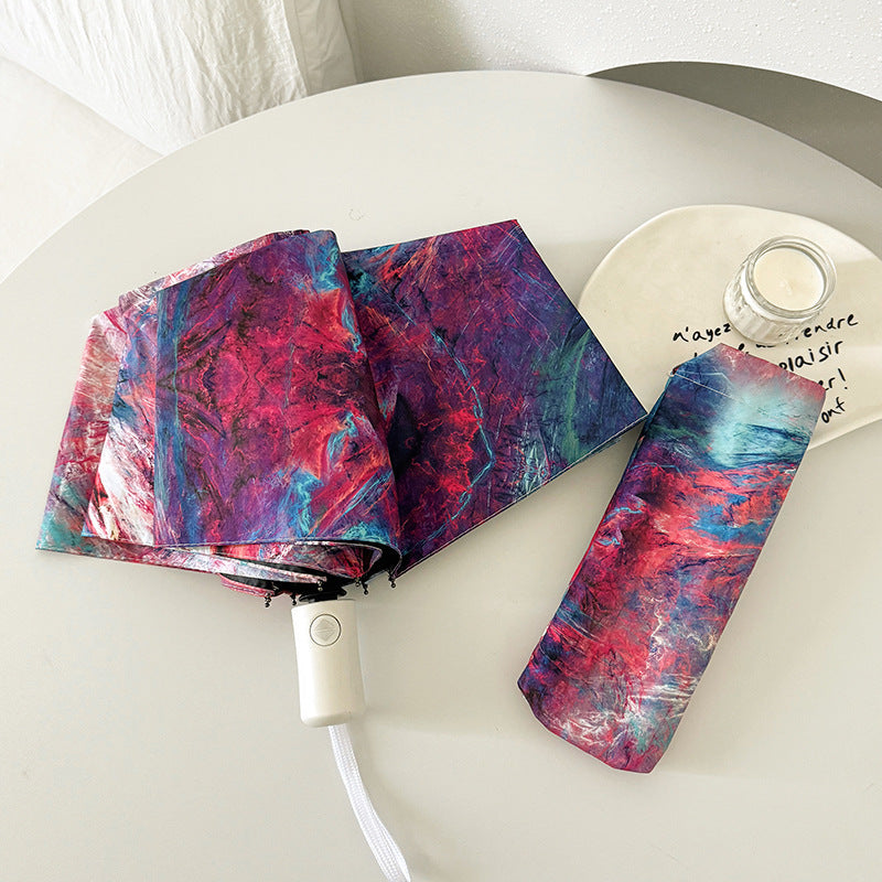 Ladies elegant folding umbrella with unique marble pattern Bowlift