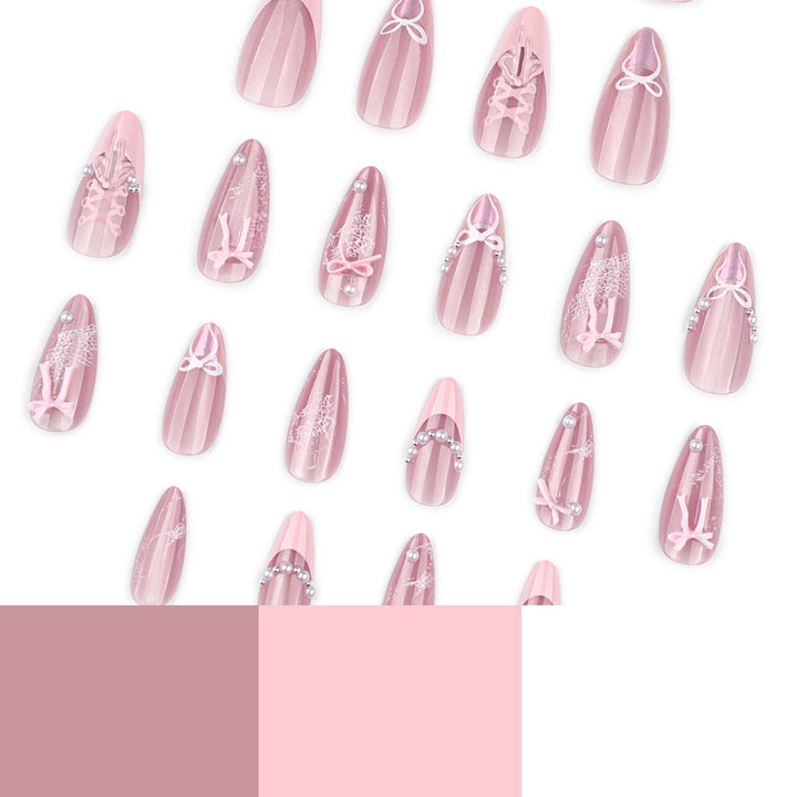 Artful nail extensions with delicate bow motifs Bowlift