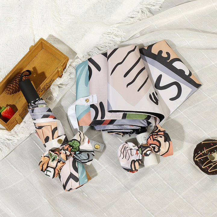 Women's folding umbrella with colorful animal design and durable frame Bowlift