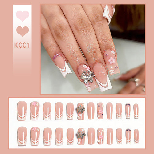 Artificial nails with floral accents and glitter effects Bowlift