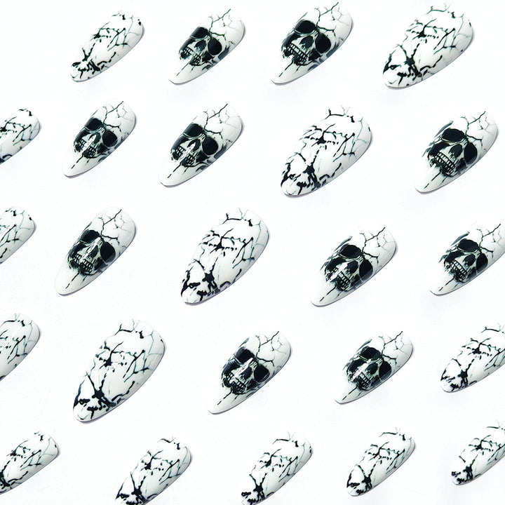 Artificial nails with playful skull design and crackle effects Bowlift