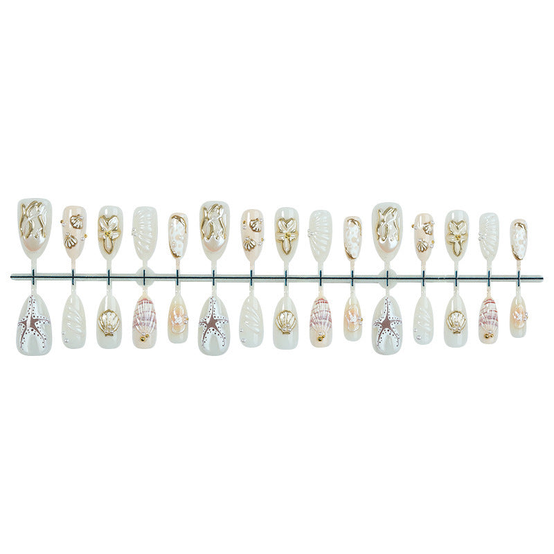 luxurious artificial nail set with maritime designs and golden accents Bowlift