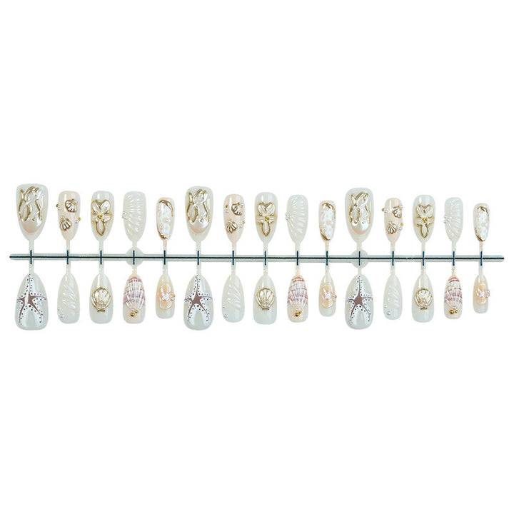 luxurious artificial nail set with maritime designs and golden accents Bowlift