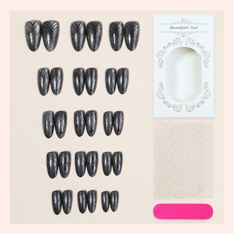Acrylic nail set with creepy spider design and glitter accents Bowlift