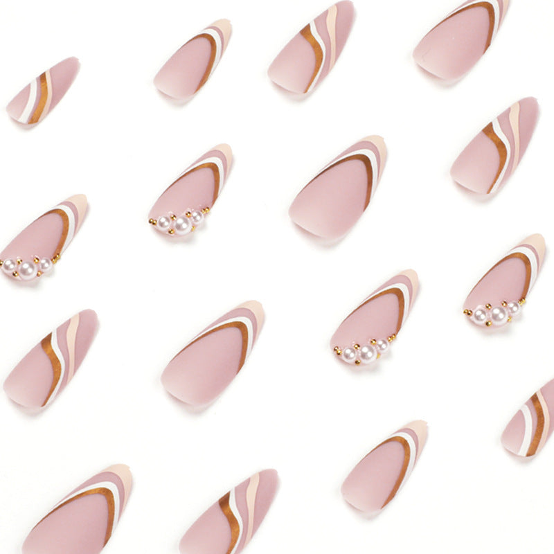 Artful stiletto nails with elegant gold and white accents Bowlift