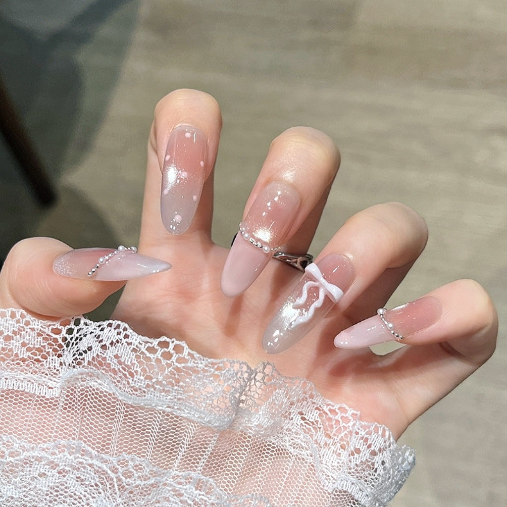 Elegant Nail Art Extensions with Pearl Accents Bowlift