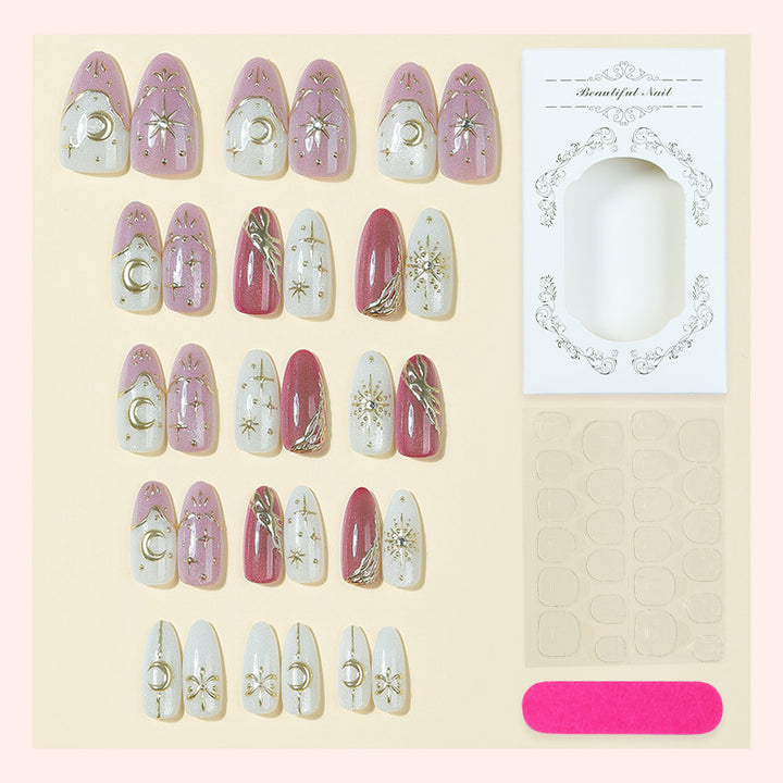 Artificial nail set with delicate gold embellishments and mystical motifs Bowlift
