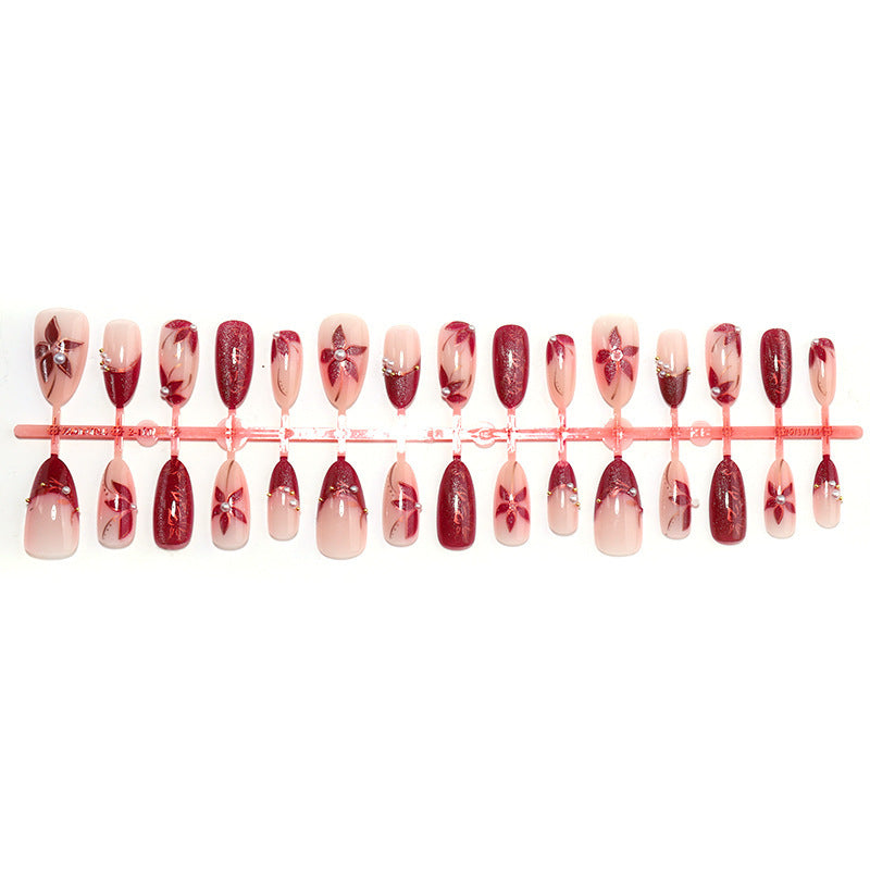 Glamorous artificial nail set with elegant floral and glitter details Bowlift