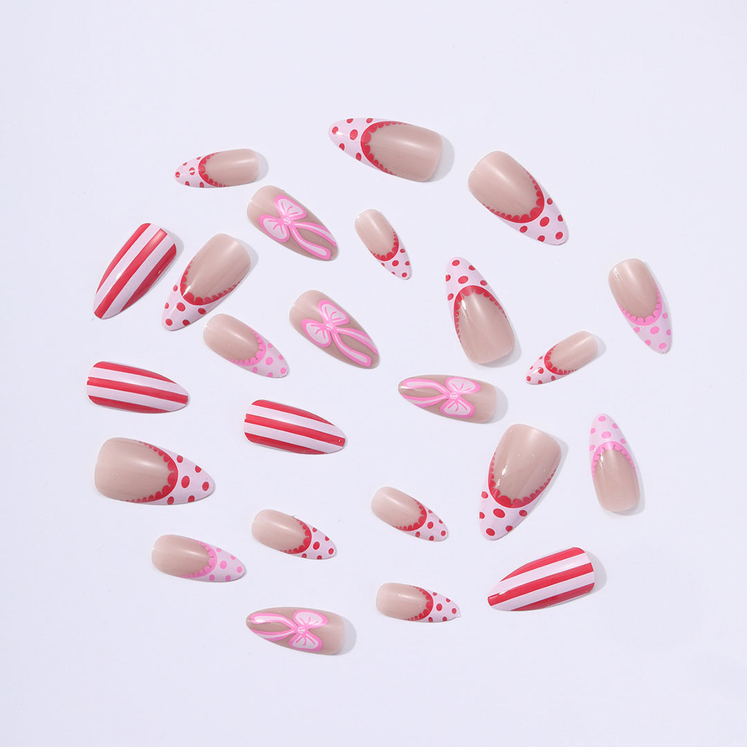 Nail set with playful bow and stripe pattern Bowlift