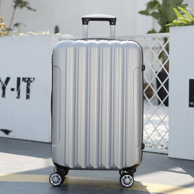 Hard shell suitcase with 360-degree wheel system and integrated safety feature Bowlift