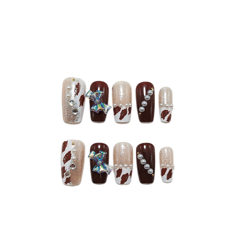 Artificial nails with glamorous rhinestone and bow design Bowlift