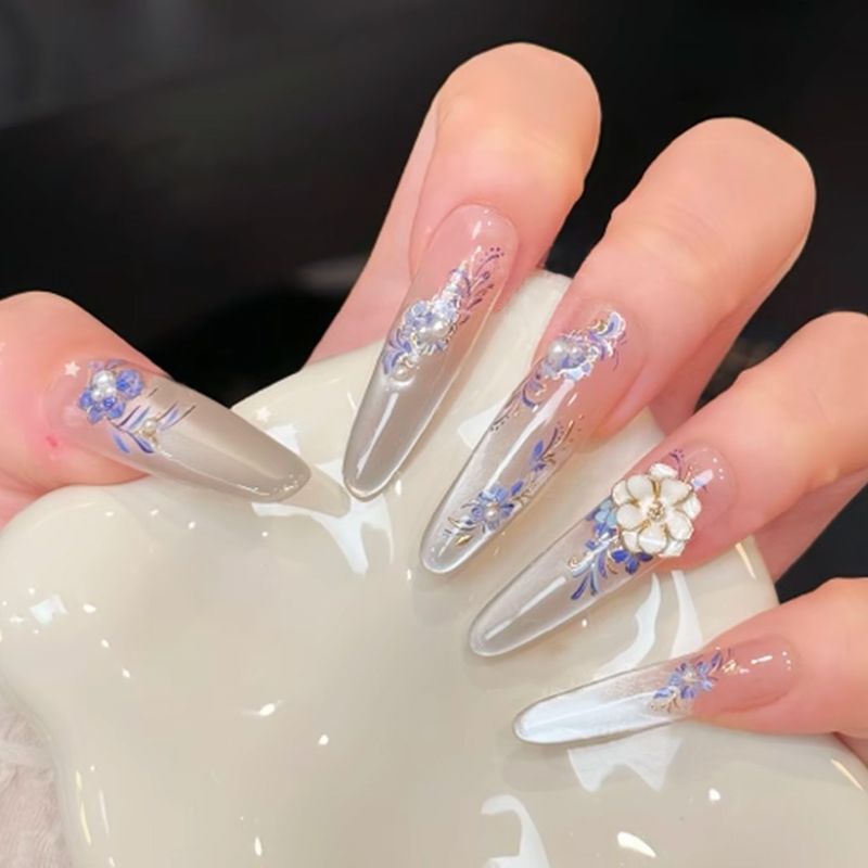 Acrylic nail set with elegant tips and glamorous rhinestone accents Bowlift