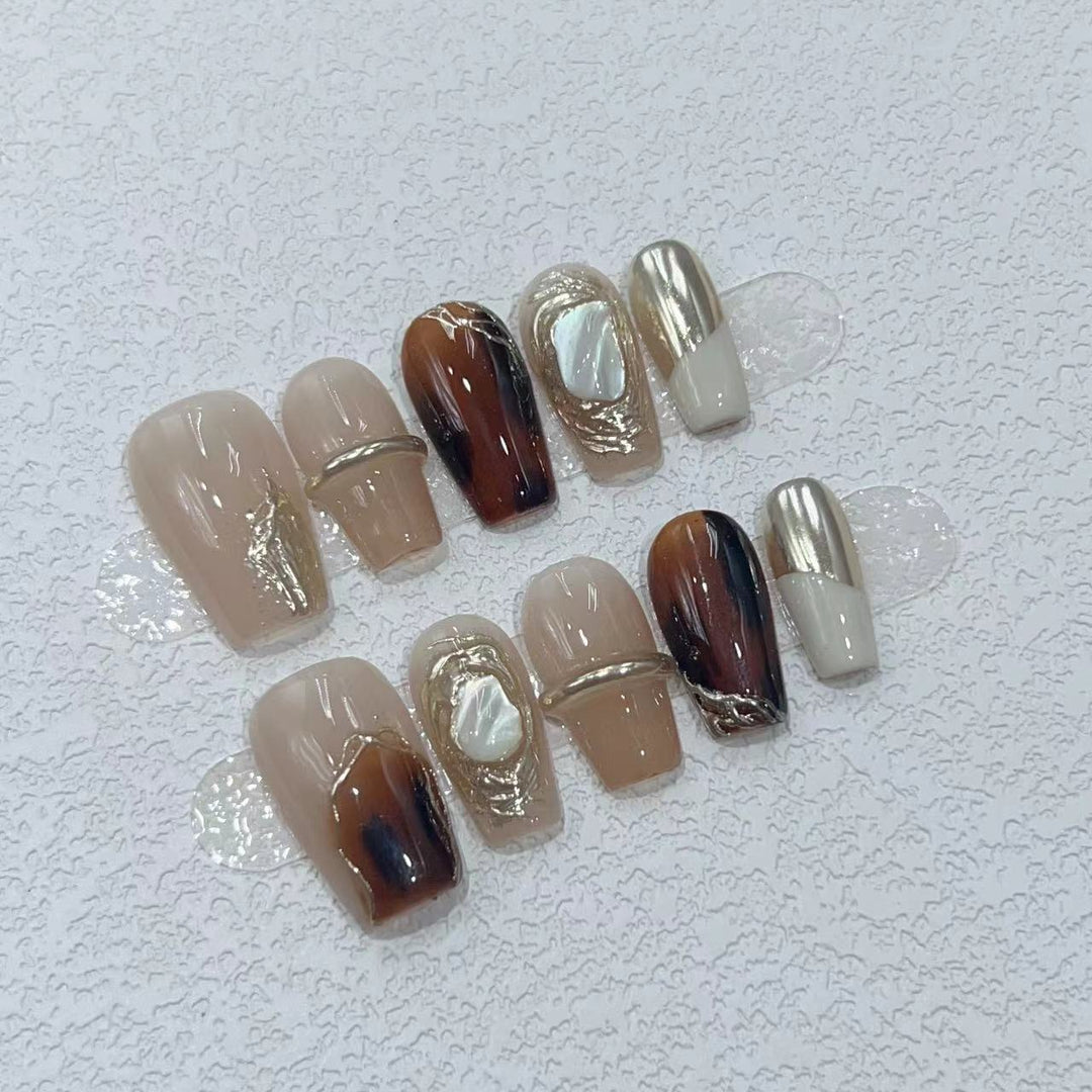 Elegant Nail Art Set with Unique Marble and Metallic Accents Bowlift