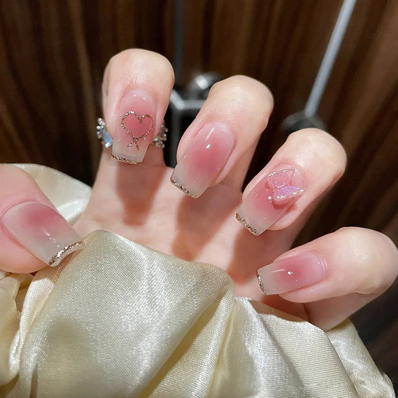 Glamorous artificial nails with heart and glitter details Bowlift