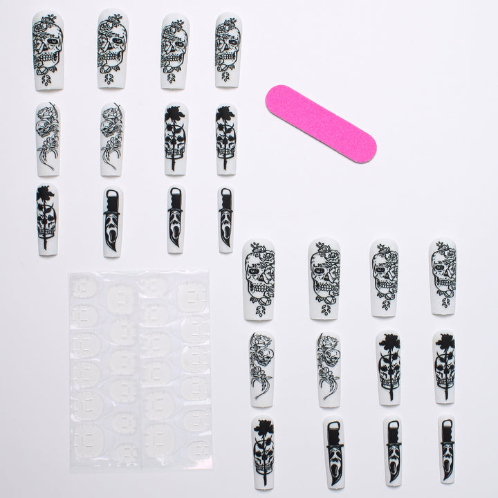 Nail set with spooky skull design and floral motifs Bowlift