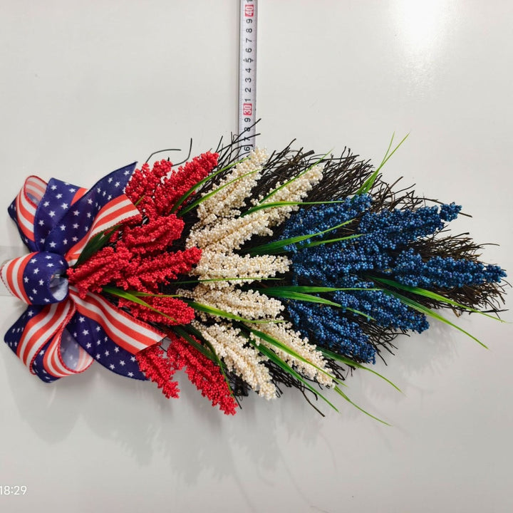 Independence Day tiered faux wildflower door swag with grosgrain stars-and-stripes bow Bowlift