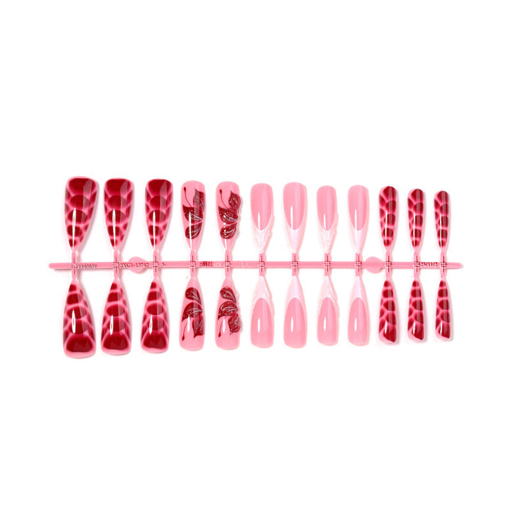 Artificial nail creations with creative patterns and glitter accents Bowlift