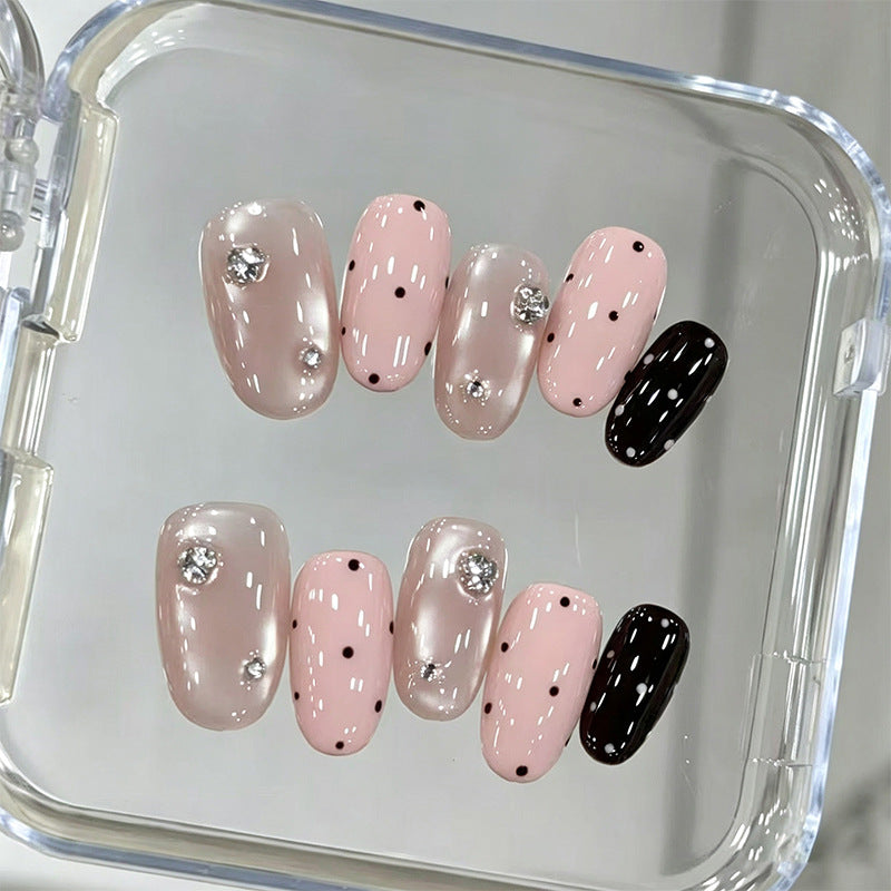 Acrylic nail set with glamorous rhinestone accents and modern dots Bowlift