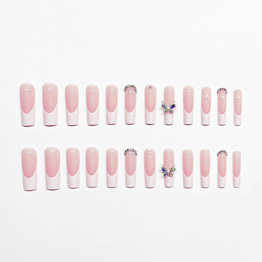 Acrylic nail set with elegant design and sparkling rhinestone accents Bowlift