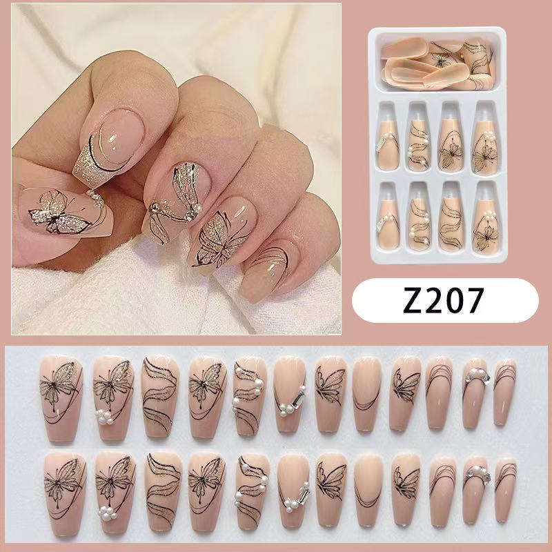 Artificial nails with filigree butterfly design Bowlift