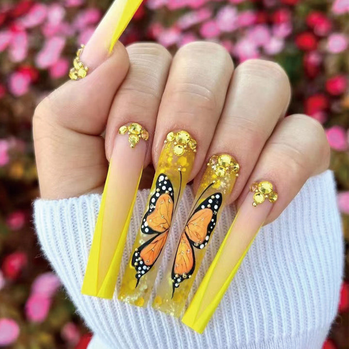 Artful Gel Nails with Butterfly Design and Glitter Bowlift