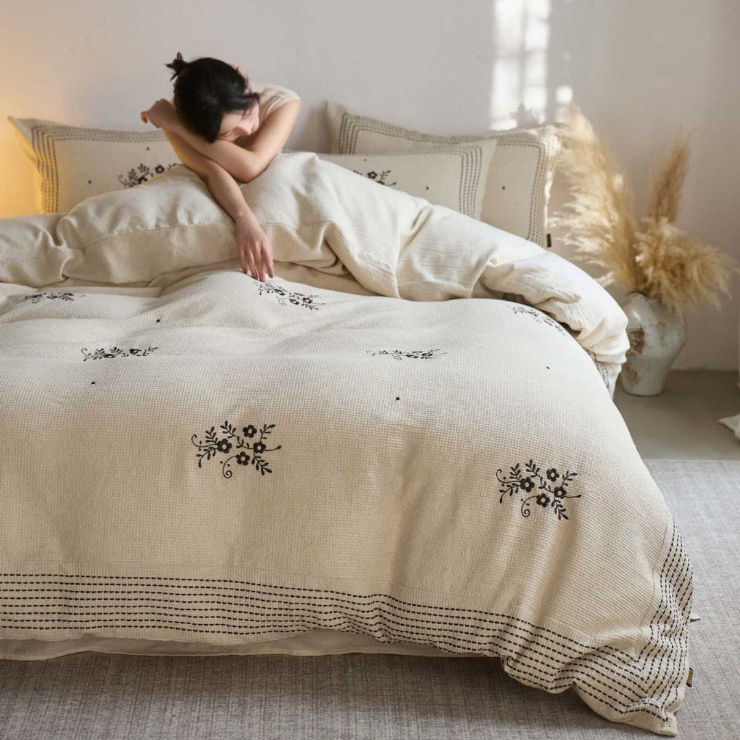 Cotton bedding set with embroidered floral motif and waffle texture